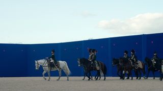 Napoleon VFX; men on horses trot past a blue screen