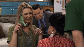 Phoebe holding a dinosaur in Friends