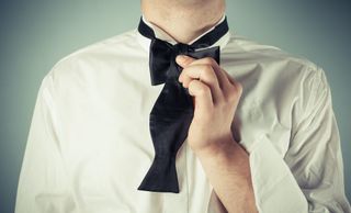 How to tie a bowtie - bring longer end over the center of the shorter end
