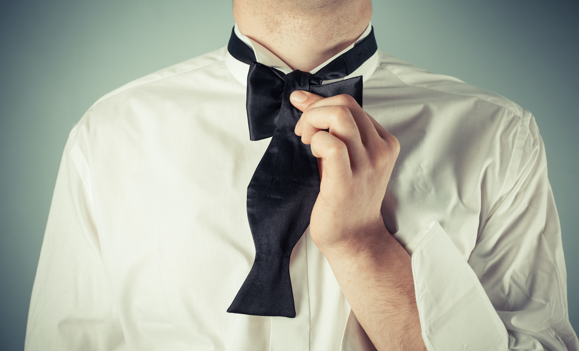 How to tie a bow tie: put the longer end in the center of the shorter