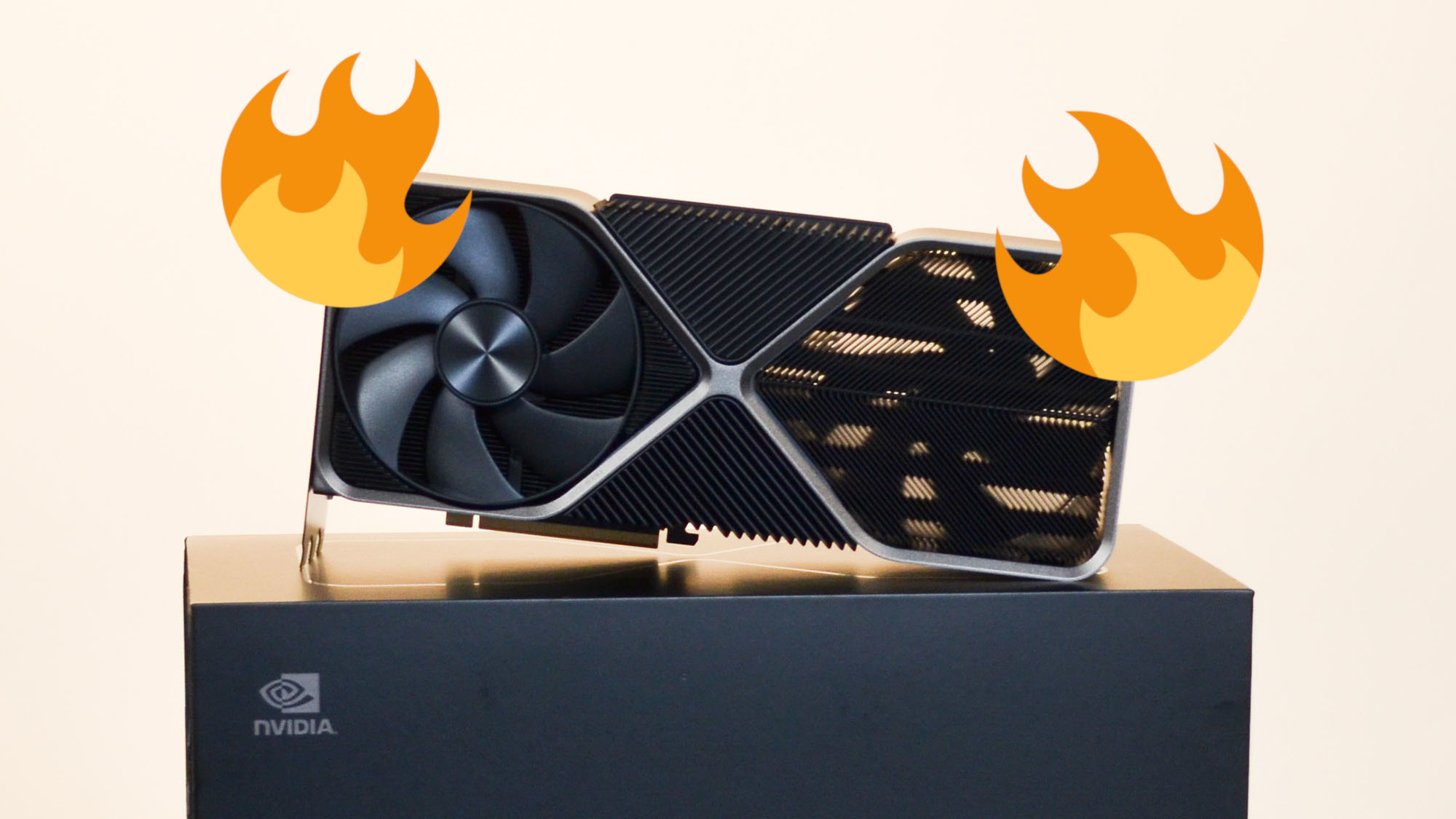 Image of the RTX 4090 propped up on its packaging, with a pair of 'fire' emojis on either side of it.