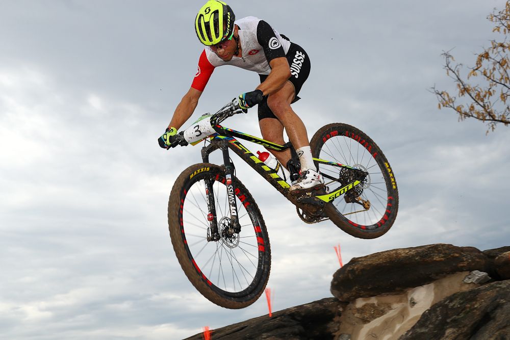 Nino Schurter goes airborne on his way to Gold.