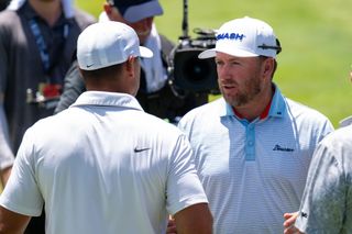 Smash GC's Graeme McDowell greets captain Brooks Koepka at LIV Golf Singapore 2024