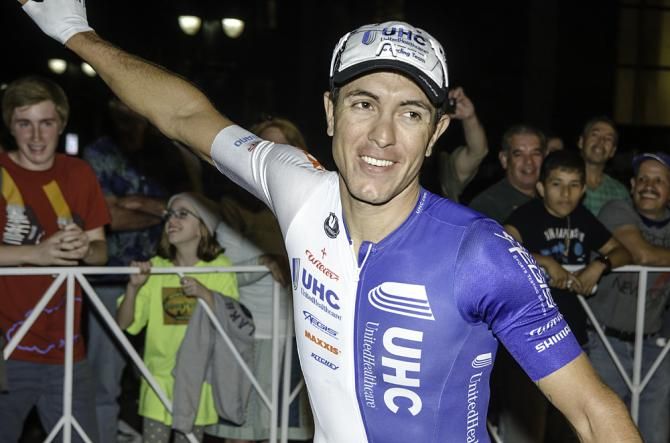 Winner of the men's pro race, UHC's Carlos Alzate, waves to the crowd after his post-race interview.