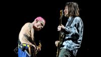 Bassist Flea (L) and guitarist John Frusciante of Red Hot Chili Peppers perform at Allegiant Stadium on April 01, 2023 in Las Vegas, Nevada