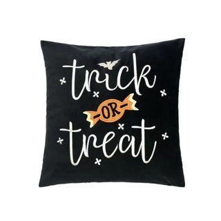 A black pillow that says 
