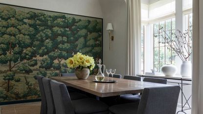 dining room with green printed wallpaper on cabinets