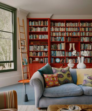 Living room with bright red shelves