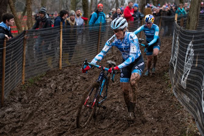 Katie Compton leads Ellen Noble through the sticky mud