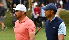 Day and Woods chat during a practice round