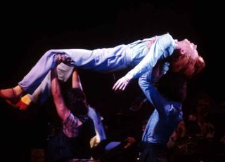 David Bowie being carried aloft by members of the crowd