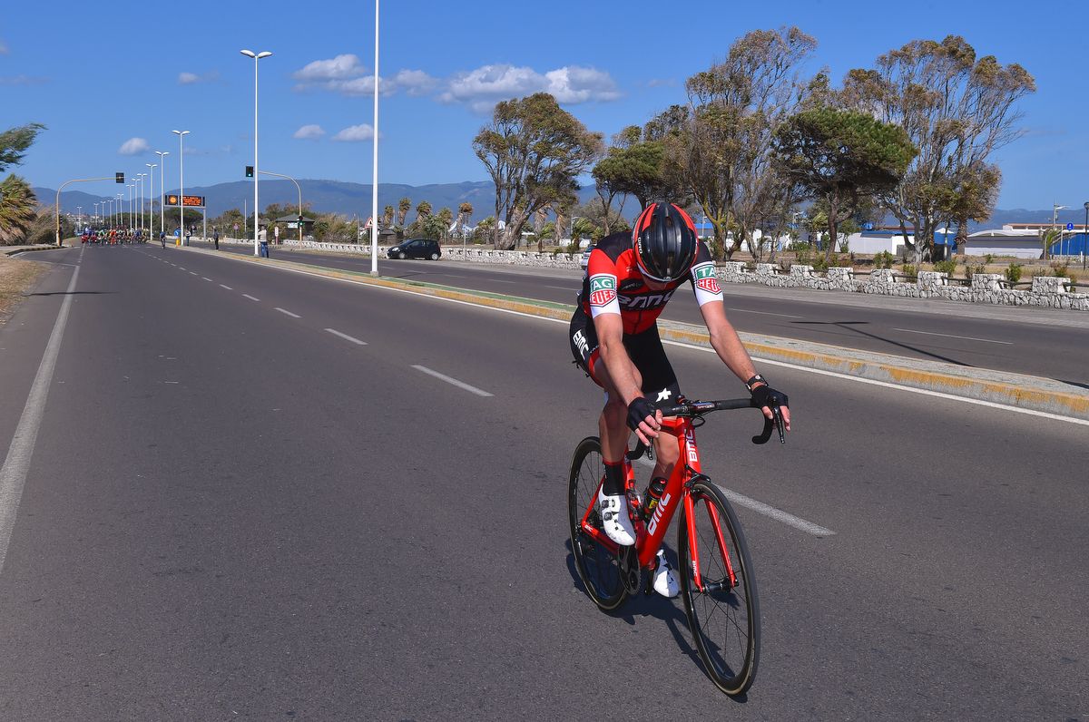 BMC's Rohan Dennis remounts following his crash as the chasers close in
