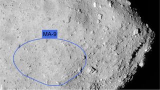 This image of asteroid Ryugu's southern hemisphere, taken by Japan's Hayabusa2 spacecraft, shows the target landing site from the German Aerospace Center's MASCOT lander.