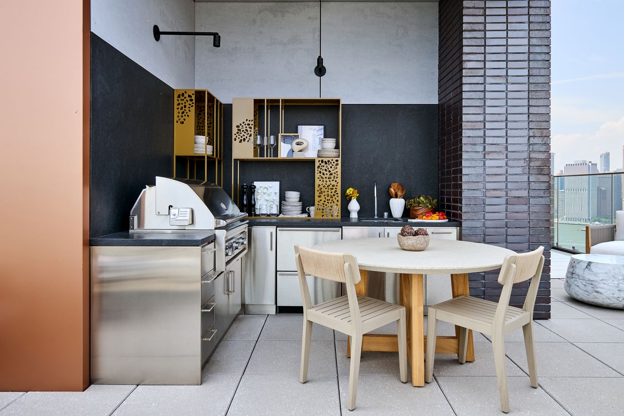 An outdoor kitchen with small, round seating