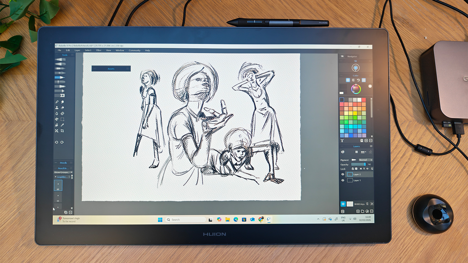 A black drawing tablet on a desk
