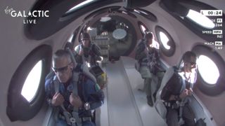 The crew aboard Galactic-01 riding the VSS Unity on a suborbital flight.