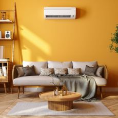 Indoor air conditioning unit installed on the wall in a living room