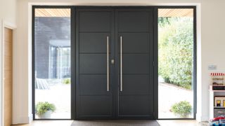 oversized double front doors and glass panels