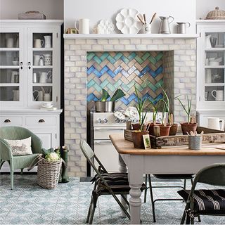 fire place with tiles and white wall and table and chairs and pots