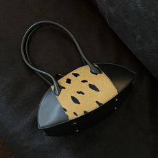 Christie Tyler with a Nina Ricci bag