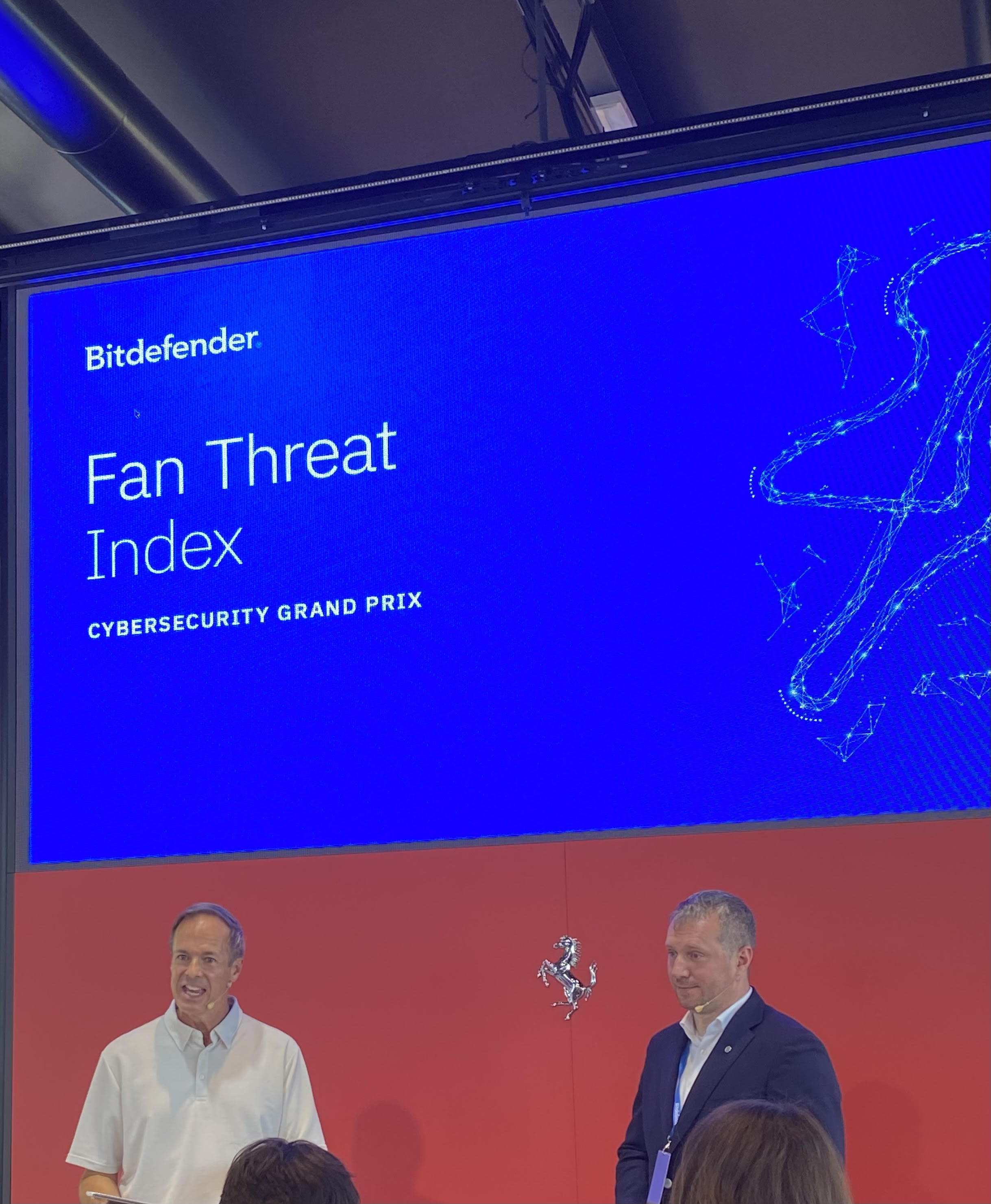 A photo of Bruce Sussman and Bogdan Botezatu presenting the Bitdefender Fan Threat Index report.