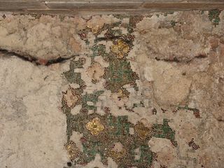 A geometric mosaic was recorded in 2012 in the interior of the church at ground level.