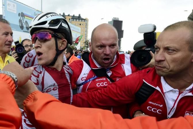 Michal Kwiatkowski (Poland) is mobbed after his win at the Worlds