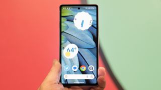 Google Pixel 7a phone showing screens camera and Android 13