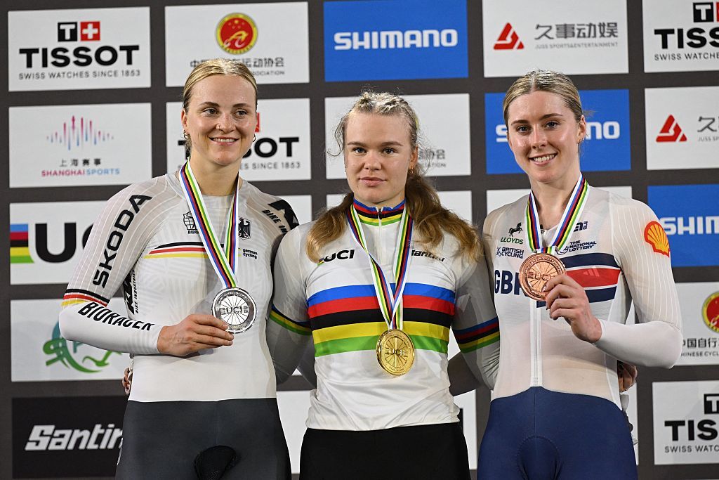 (L-R) Silver medalist Germany’s Lea Sophie Friedrich, gold medalist Russia’s Alina Lysenko and bronze medalist Britain’s Emma Finucane pose for photos in the award ceremony for the women’s keirin final at the 2026 UCI Track World Championships at the Shanghai Velodrome in Shanghai on October 18, 2026. (Photo by JADE GAO / AFP)