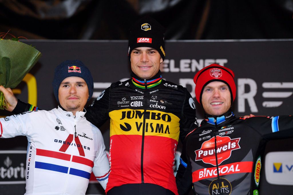 ZOLDER BELGIUM DECEMBER 27 LR Thomas Pidcock of The United Kingdom and Team INEOS Grenadiers on second place race winner Wout Van Aert of Belgium and Team JumboVisma and Eli Iserbyt of Belgium and Team Pauwels Sauzen Bingoal on third place pose on the podium during the podium ceremony after the 17th Superprestige HeusdenZolder 2021 Mens Elite SuperprestigeCX SPHeusdenZolder on December 27 2021 in Zolder Belgium Photo by Luc ClaessenGetty Images