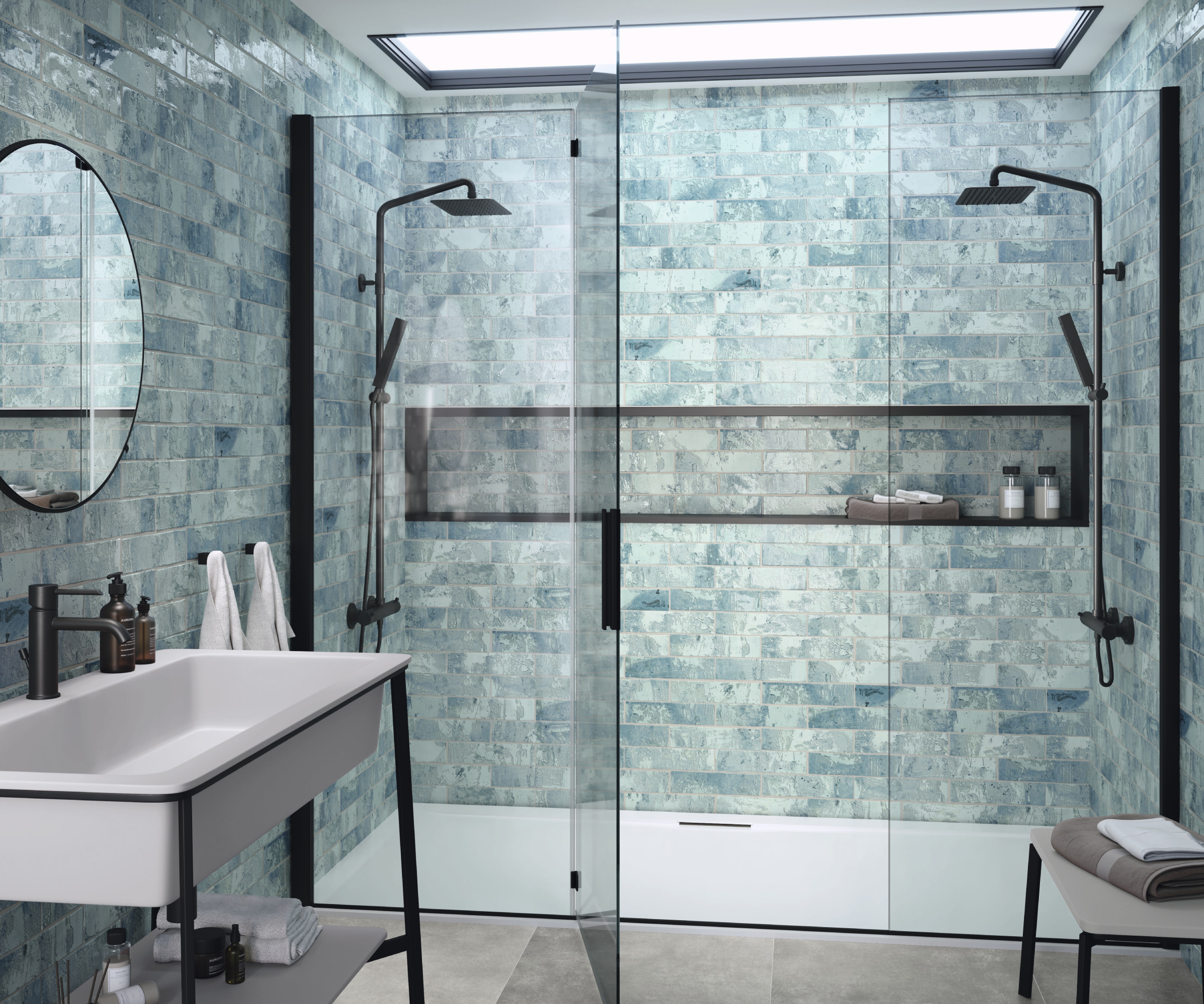 shower room with double shower behind glass doors and blue wall tiles