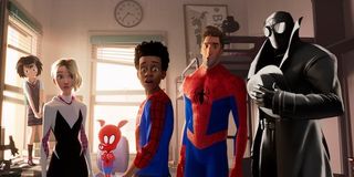 Spider-Man: Into The Spidervers Miles Morales standing in his dorm room with several other spider pe