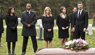 diggle, felicity, thea and oliver at a funeral on arrow season 4