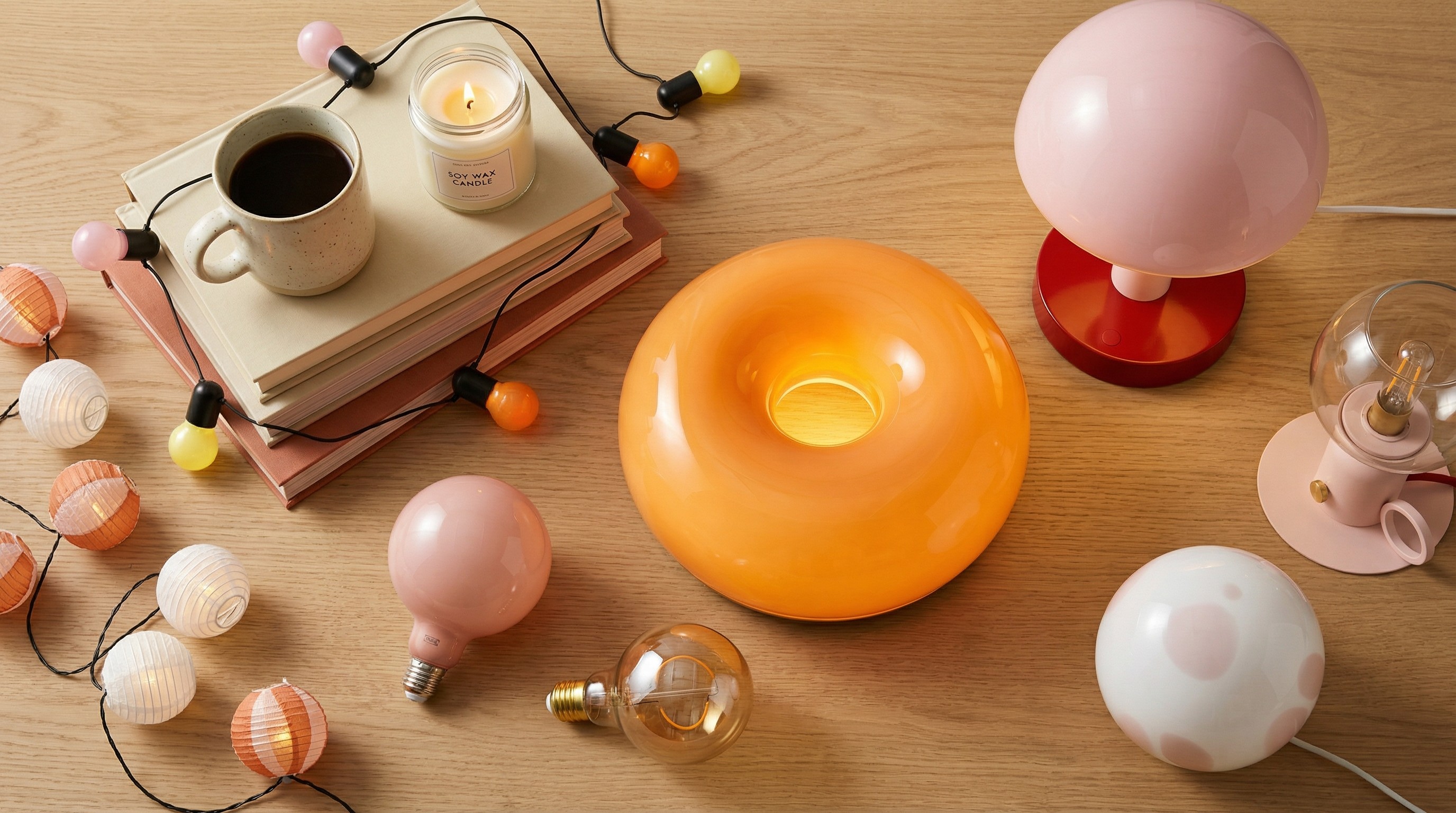Collection of warm-coloured IKEA lights on wooden table