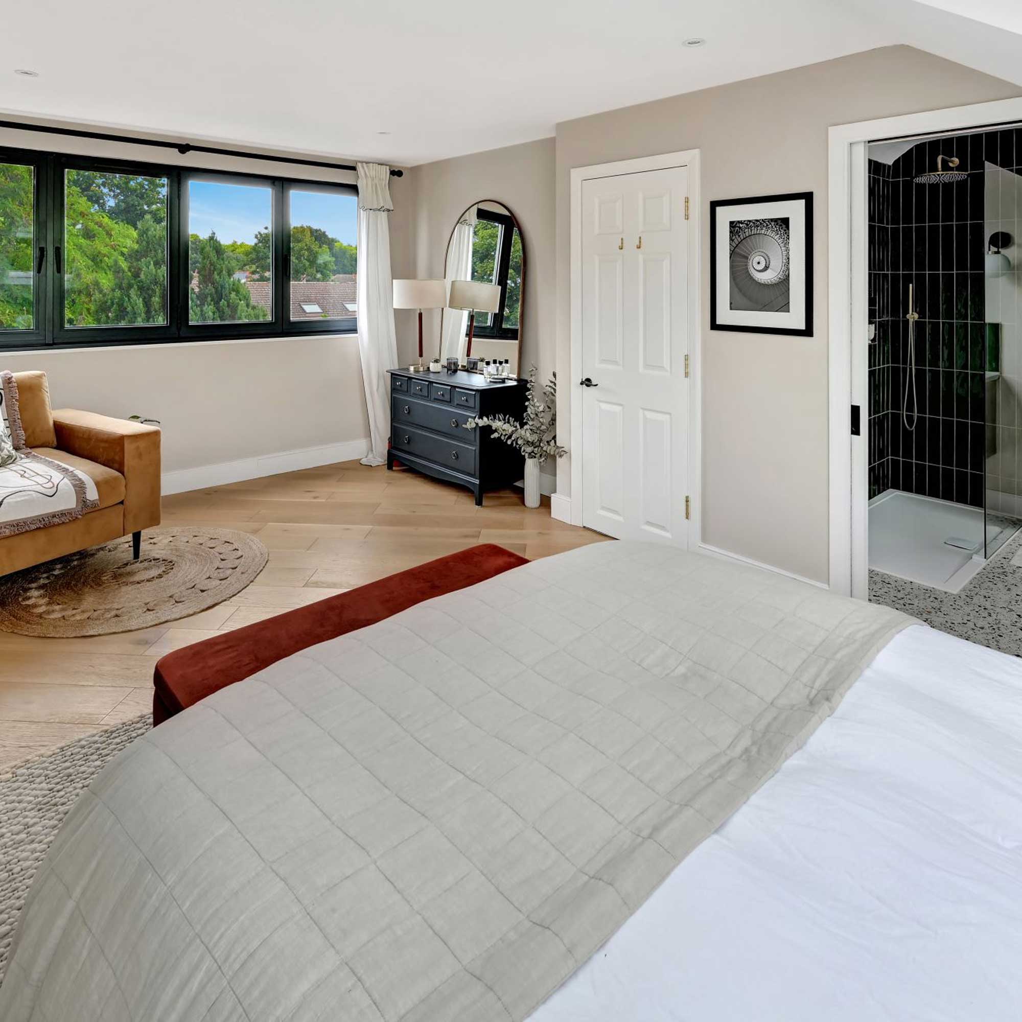 large loft conversion bedroom with ensuite bathroom