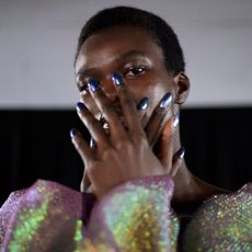 a model wearing nail polish