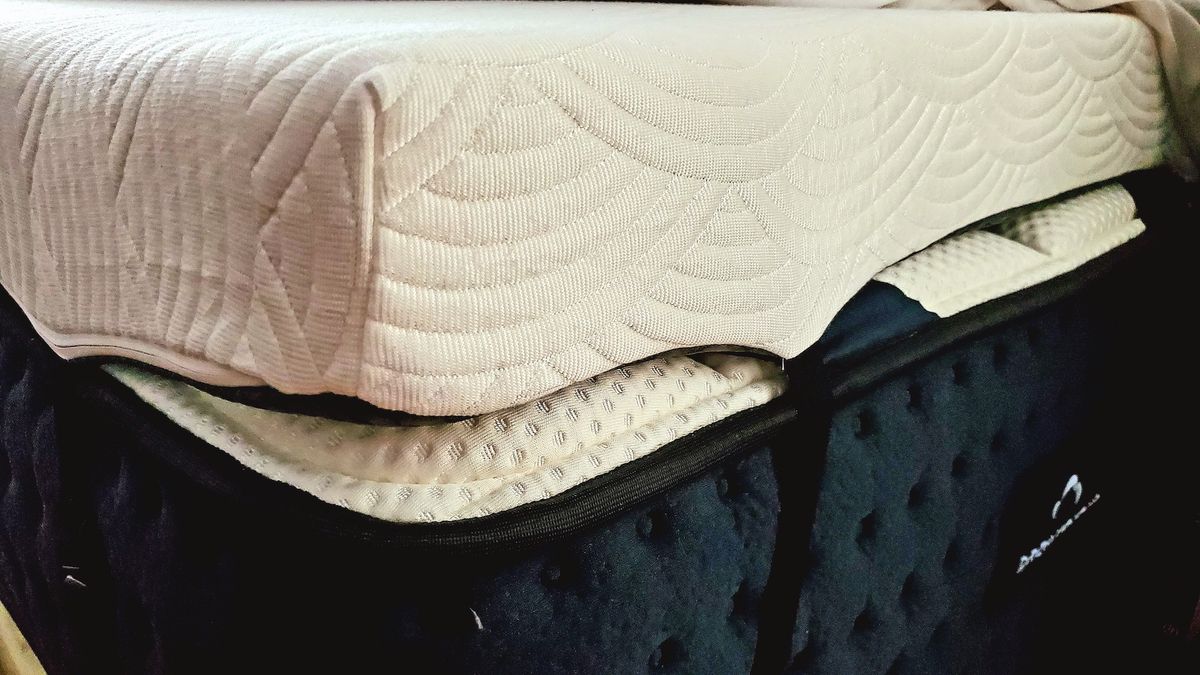 A close-up of the corner straps of the Viscosoft Active Cooling Mattress Topper