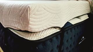 Viscosoft Active Cooling Mattress Topper in white placed on top of a DreamCloud mattress for review purposes