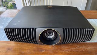 BenQ W5800 home cinema projector viewed from front slight raised angle