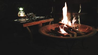 fire pit with flames at night