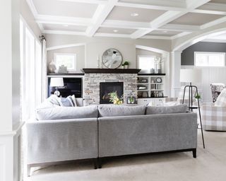 Light and breezy living room with white painted ceiling beams