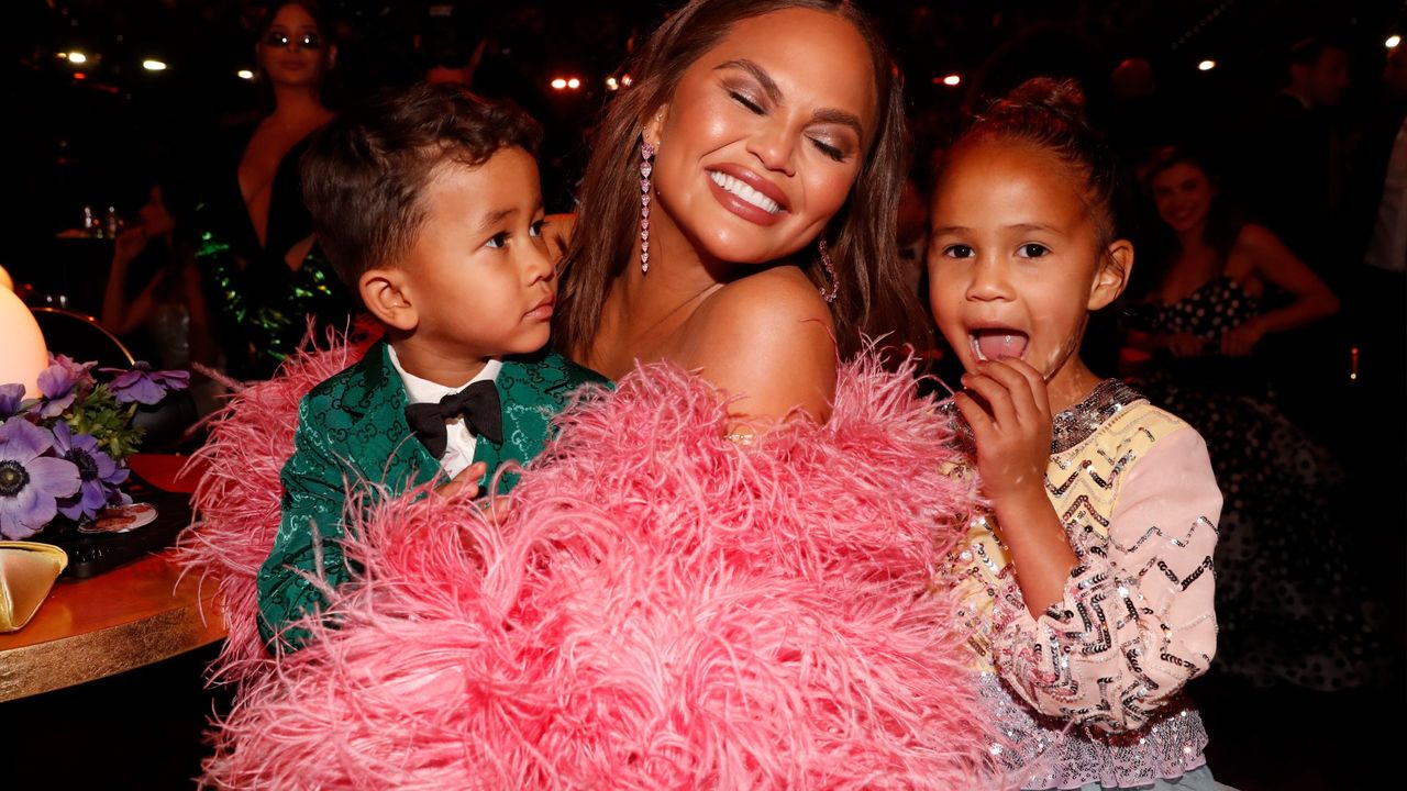 Miles Stephens, Chrissy Teigen, and Luna Stephens attend the 64th Annual GRAMMY Awards at MGM Grand Garden Arena on April 03, 2022 in Las Vegas, Nevada.