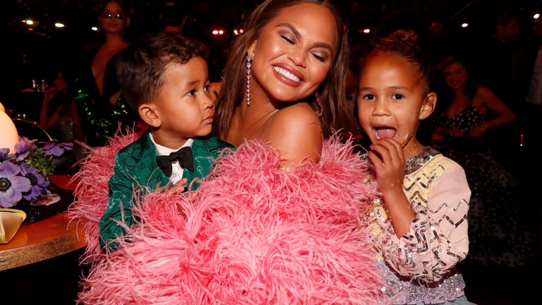 Miles Stephens, Chrissy Teigen, and Luna Stephens attend the 64th Annual GRAMMY Awards at MGM Grand Garden Arena on April 03, 2022 in Las Vegas, Nevada.