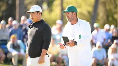 Tom Kim and Paul Tesori during the 2024 Masters.