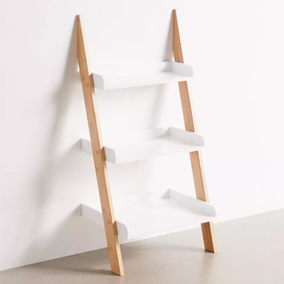 A white and wooden ladder shelf