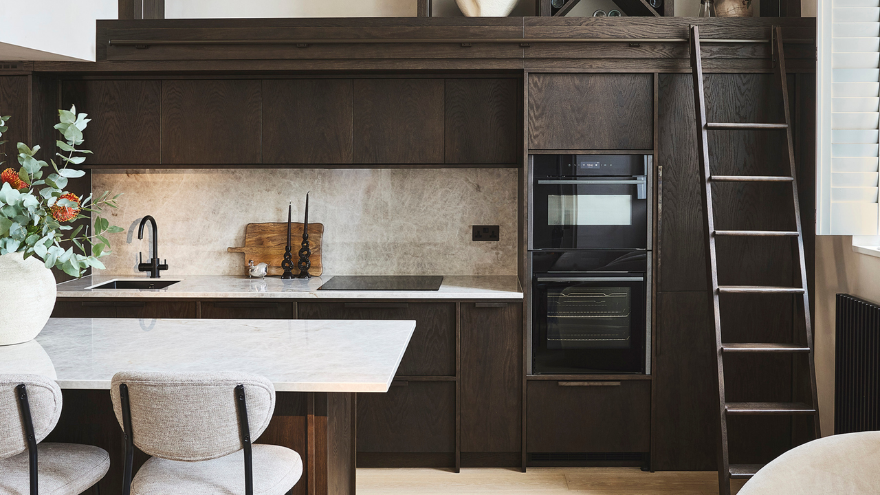 dark wood small kitchen with a ladder