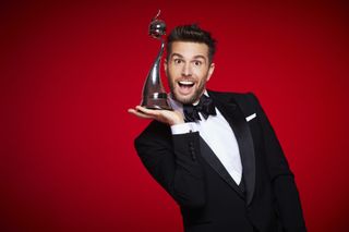 Joel Dommett presents the awards.