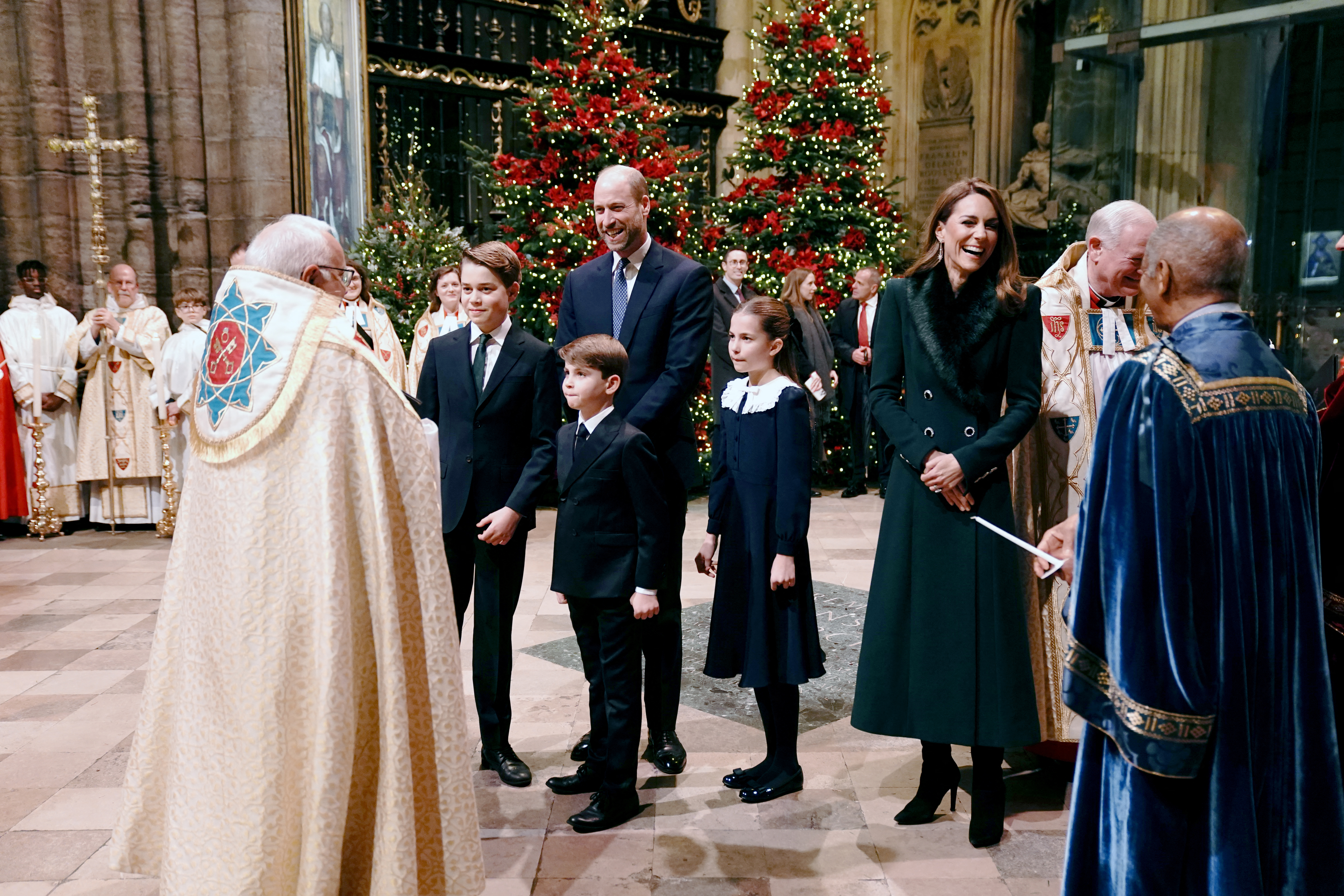 Prince William, Princess Kate, Prince George, Prince Louis, Princess Charlotte laughing and talking to clergymen at Westminster Abbey during Together at Christmas 2025