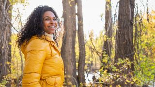 Woman pausing on a hike looking at the view