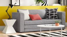 A Wayfair sofa & rug in a living room